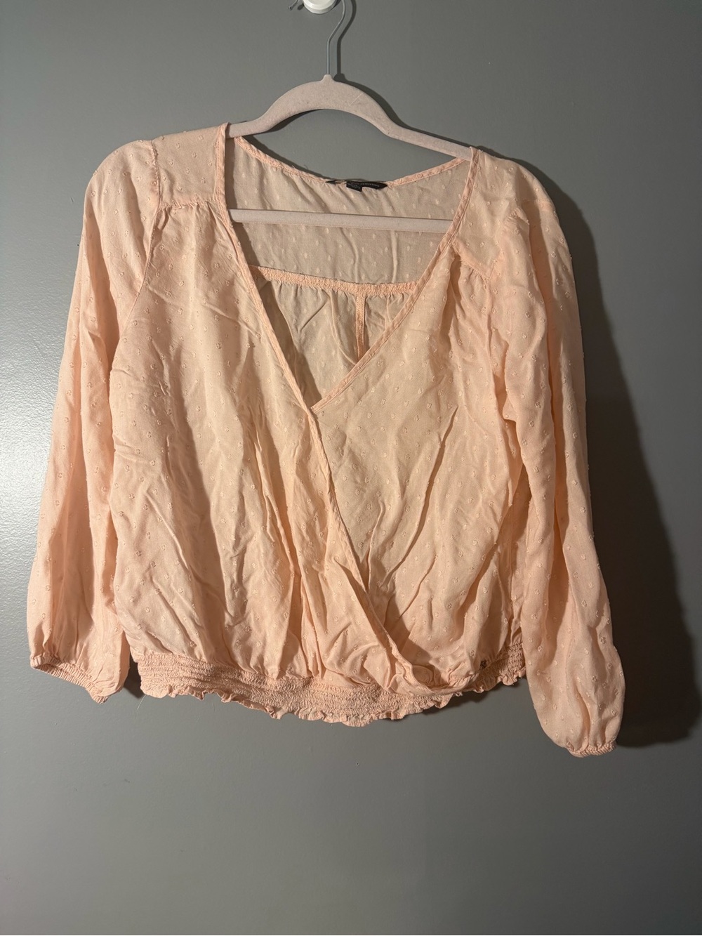 American Eagle Outfitters light pink dobby dot wrap blouse